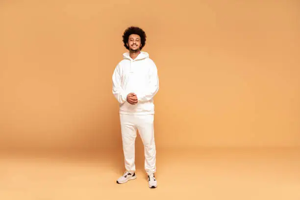 Photo of Fashionable afro man in tracksuit.
