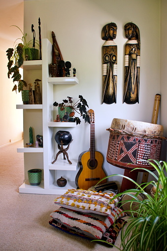 Close-up of tribal decor collected from Africa displayed in home interior in a Boho Travel Style.