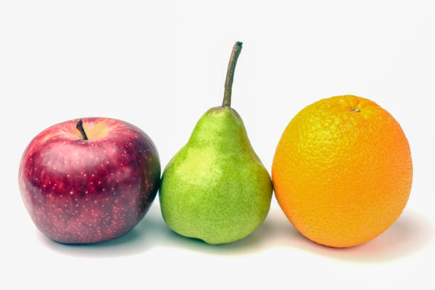 istock orange and green pear and red Apple close up on a white background 1275676191