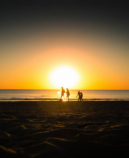 family at the sunset beach