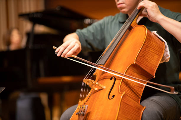 istock Close up of cellist playing at classical concert 1275677102
