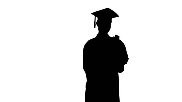 istock Silhouette Smiling female student in graduation robe posing with 1275677658