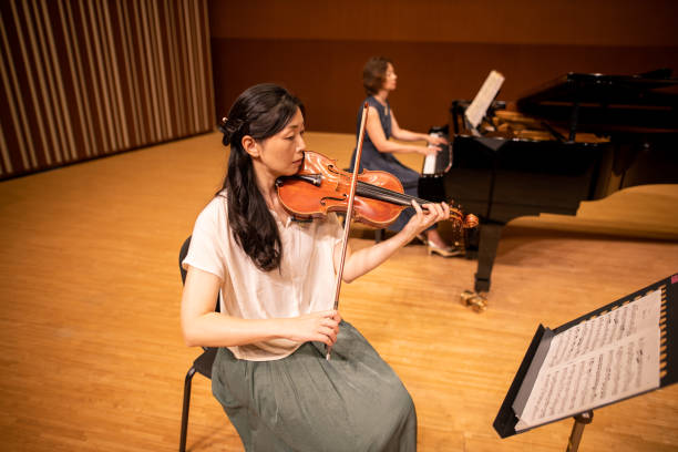 istock Violinist and pianist at classical concert 1275677698