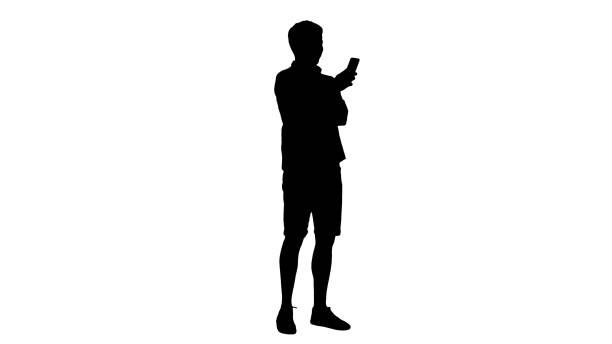 istock Silhouette Handsome young man using his smartphone and laughing 1275677726