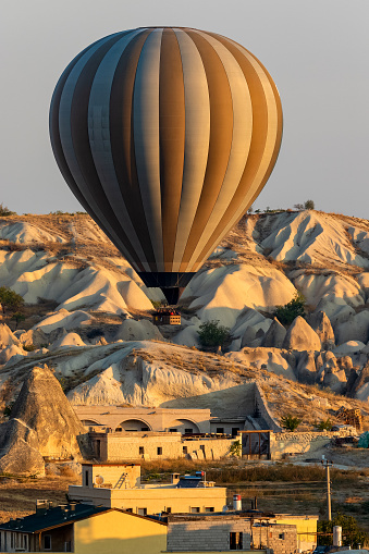 Hot air balloons in Cappadocia with rock formation