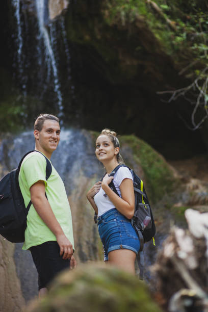 istock Exploring the mountains waterfall and enjoying in nature 1275679326