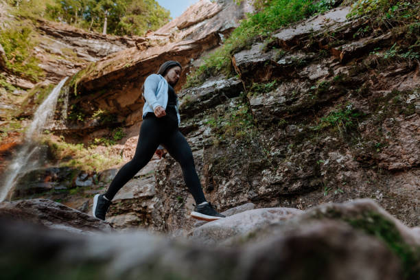 istock Friends hiking on the mountain with waterfall 1275679497