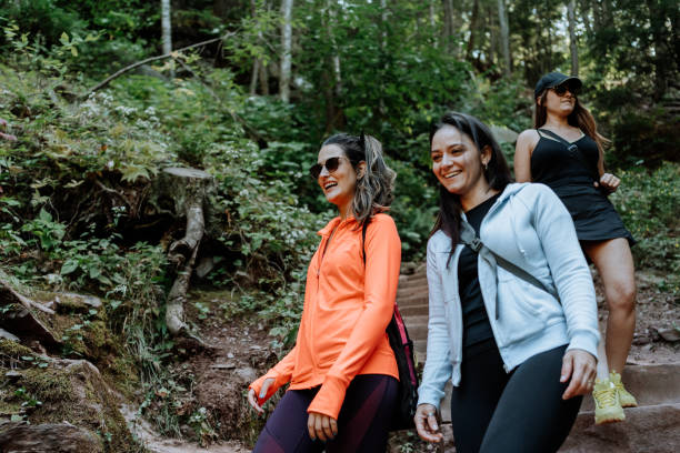 istock Friends hiking on the mountain with waterfall 1275679552