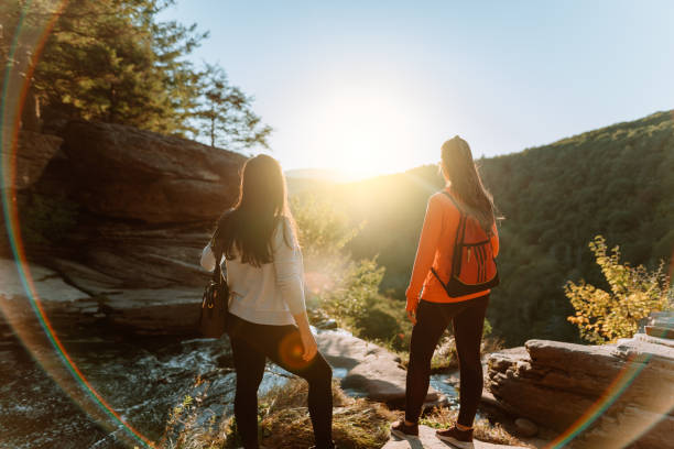 Friends hiking on the mountain with waterfall