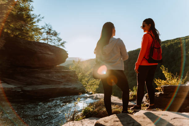 istock Friends hiking on the mountain with waterfall 1275679618