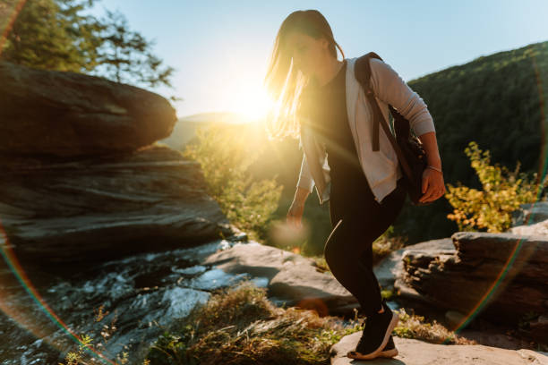 istock Friends hiking on the mountain with waterfall 1275679738