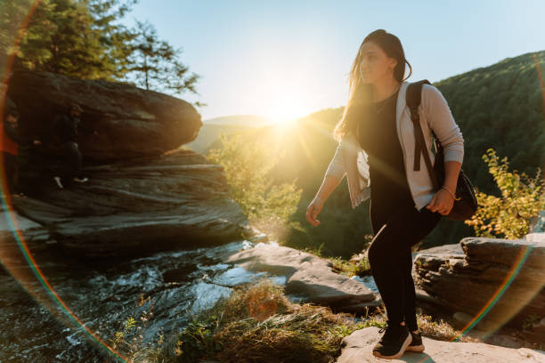 istock Friends hiking on the mountain with waterfall 1275679776