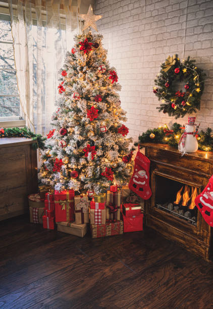istock Decorated Christmas Tree Near Fireplace at Home 1275681145