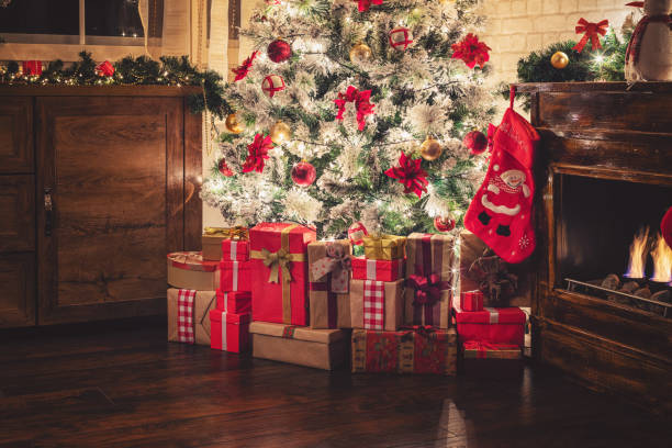 istock Decorated Christmas Tree Near Fireplace at Home 1275681161