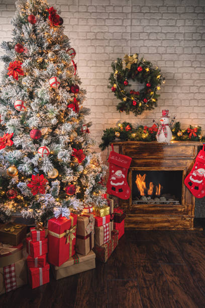 istock Decorated Christmas Tree Near Fireplace at Home 1275681171