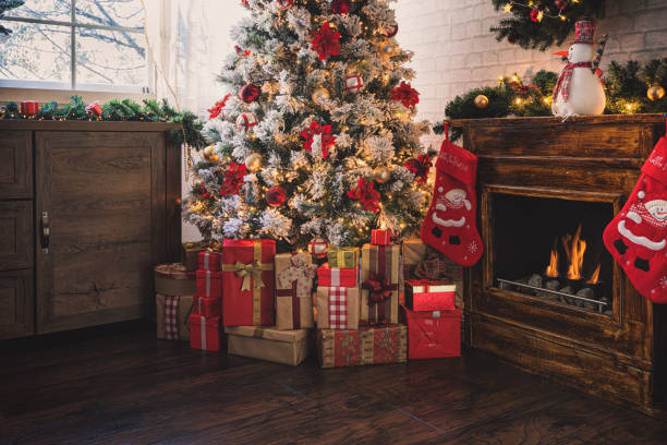 istock Decorated Christmas Tree Near Fireplace at Home 1275681192