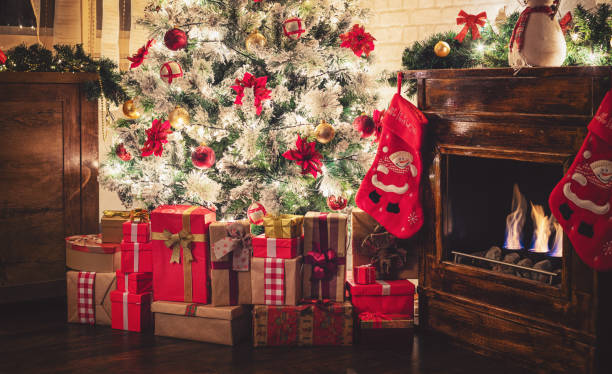 istock Decorated Christmas Tree Near Fireplace at Home 1275681219