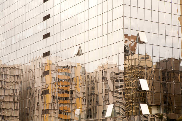 istock Old building reflextions on a modern glass building 1275698628
