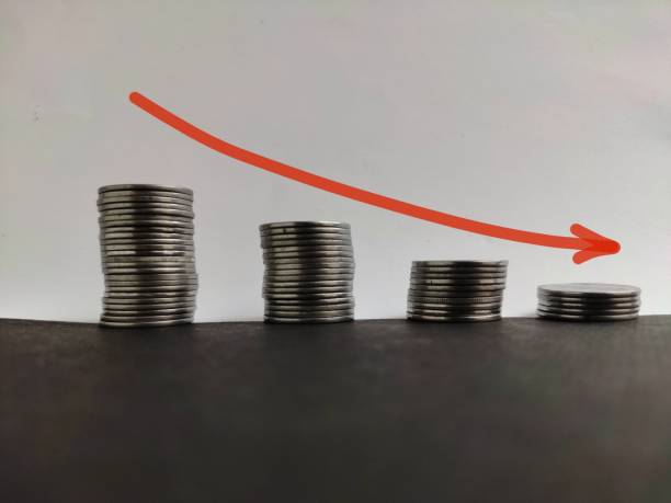 istock Coin stack step down graph with red arrow, Risk management business financial and investment, Copy space 1275699312