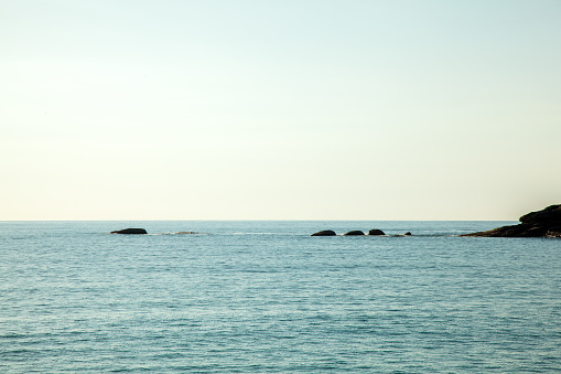 Sea sky and rocks on beach
