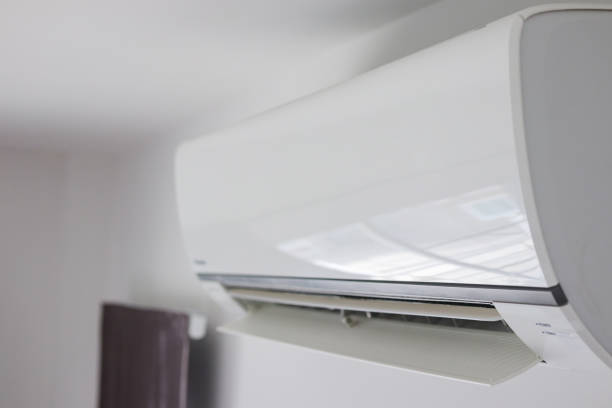 istock Air conditioner on white wall room interior background 1275708016