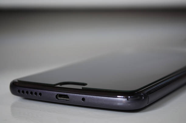 istock Selective focus of a smartphone on white background. Technology and connectivity concept. 1275708706