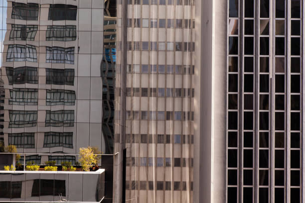 istock Modern glass windows in concrete building facade - urban modern architecture 1275710745