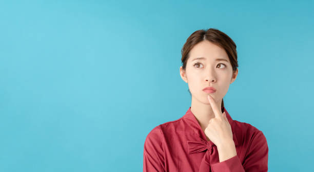 istock Thinking asian woman. 1275737378