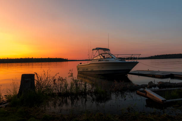istock Boat At Sunset Docked Alongside A Pier 1275739989