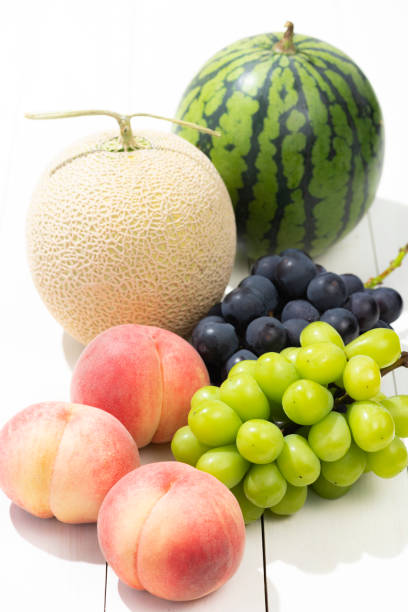 istock Summer fruits on a white board. 1275744960