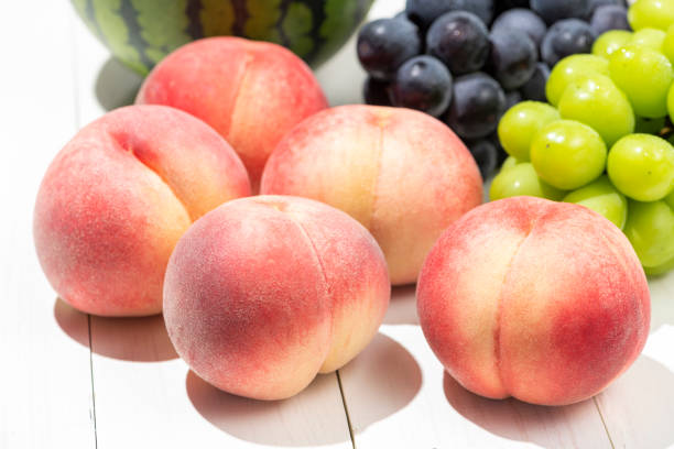 istock Summer fruits on a white board. 1275744966