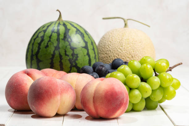 istock Summer fruits on a white board. 1275744970