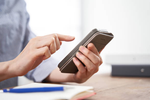 istock A Japanese woman at her fingertips using a smartphone 1275745930