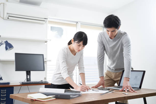 istock Japanese architects at a casual office meeting 1275745991