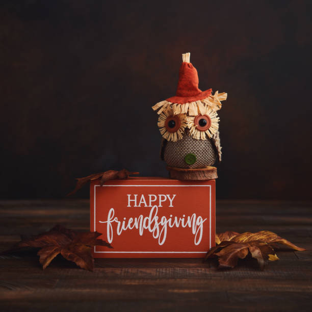 istock Fall background with rustic owl and Happy Friendsgiving Sign 1275746077