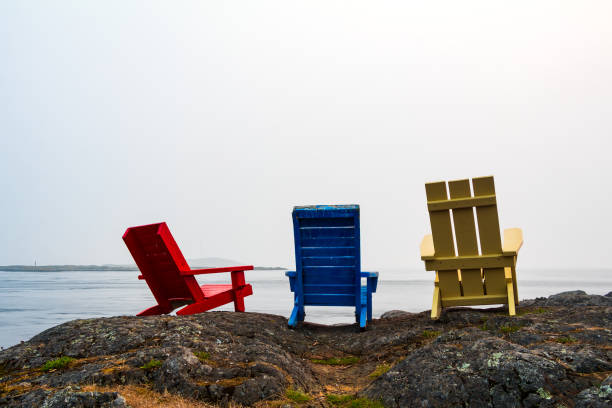istock Colorful Chairs Along The Shoreline 1275747685