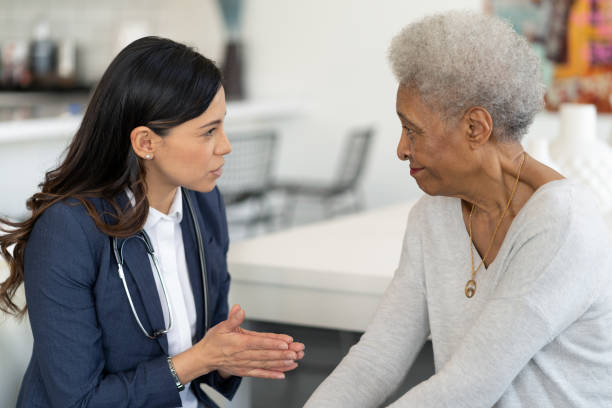 istock Female doctor discusses with a senior patient 1275749192