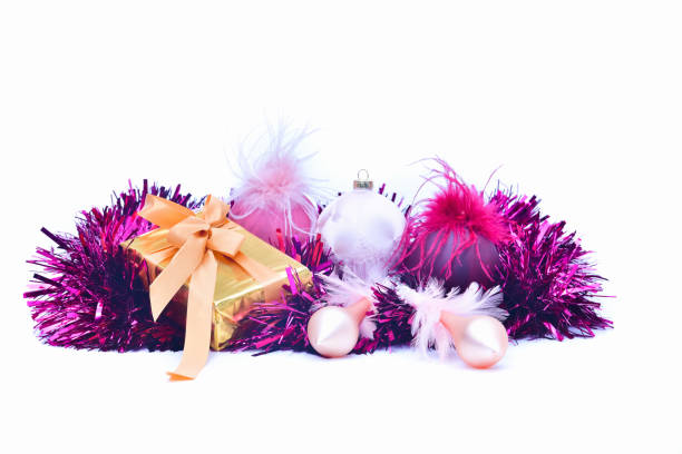 istock a beautiful Christmas bauble next to a golden wrapped gift box on a light background. Christmas gifts and decoration concept. 1275749249