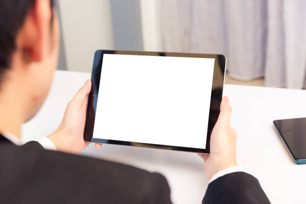 istock Back view of Businessman video conference by tablet 1275752935