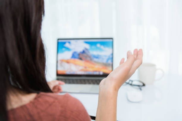 istock Back businesswoman video conference on front laptop computer 1275752977