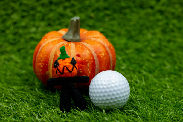 istock Golf ball with ghost on green grass for golfer on Halloween day 1275754479