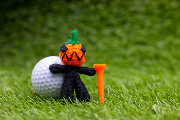 istock Golf ball with ghost on green grass for golfer on Halloween day 1275754502