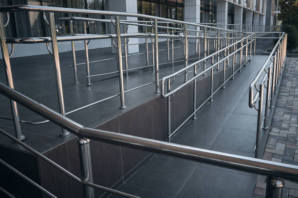 istock Ramp for people with disabilities and chrome railings 1275754513