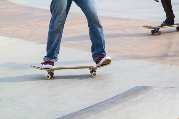 istock Young man practising on skateboard in skate park 1275754717