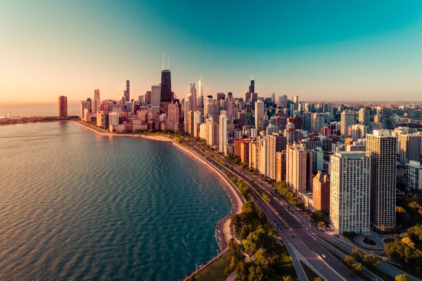 istock Chicago skyline aerial view with light effect applied. Sunrise above downtown buildings 1275755405