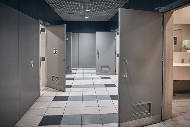 istock Toilet hallway with open doors in an airport 1275756444