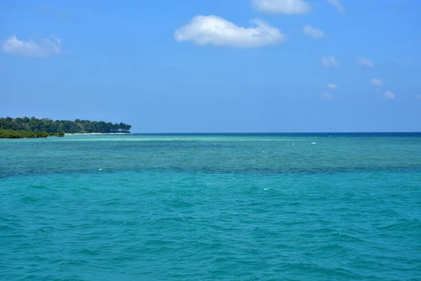 istock The seascape with blue water and sky. 1275759647