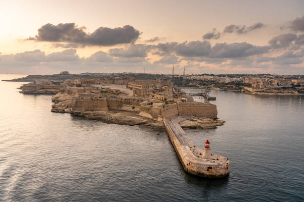 istock view on lighthouse of valetta at sunset, malta 1275759679