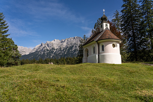 view on karwendel mountains and the chapel maria koenigin (queen maria), bavaria, germany