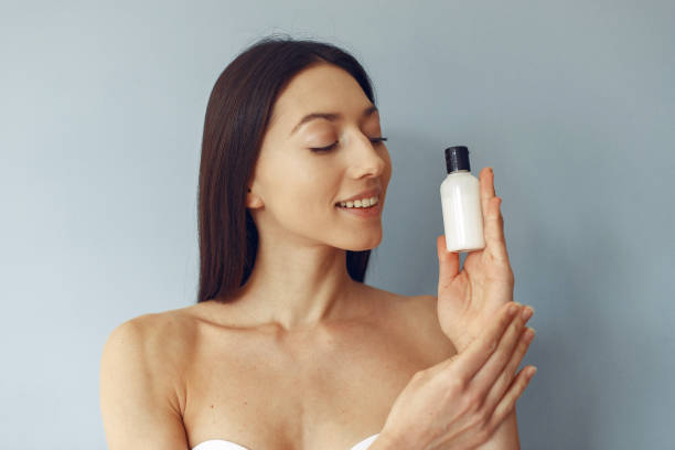 istock Beautiful girl standing in a studio with cream 1275761654
